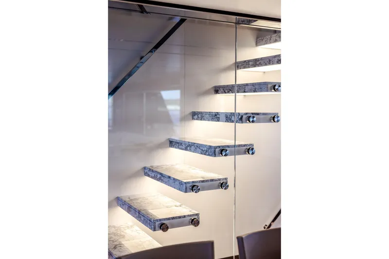 Slide: The Image of Luxurious deck of 2025 Riva 130' Bellissima yacht with elegant seating and ocean view. - 34