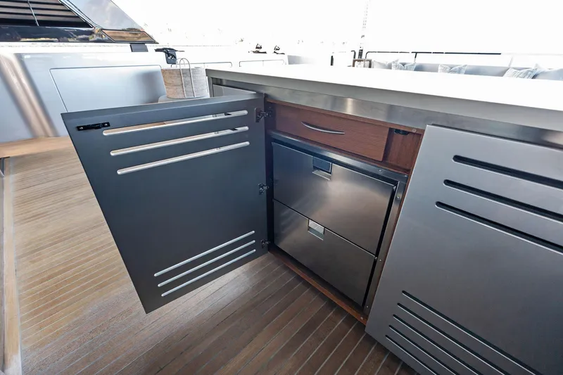 Slide: The Image of Open cabinet on Riva 130' Bellissima yacht, showcasing sleek stainless steel drawers, 2025 model. - 36