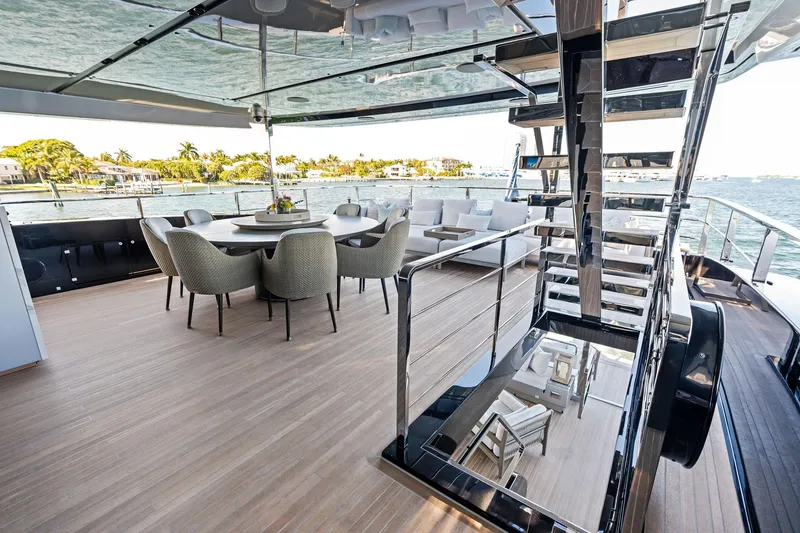 Slide: The Image of Luxurious deck of 2025 Riva 130' Bellissima yacht with elegant seating and ocean view. - 37