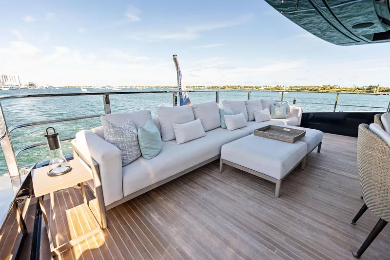 Slide: The Image of Luxurious outdoor seating on 2025 Riva 130' Bellissima yacht, overlooking serene waters. - 38