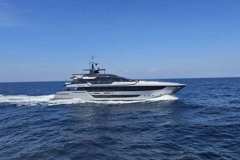 Slide: The Image of Luxurious 2025 Riva 130' Bellissima yacht cruising on clear blue waters. - 4