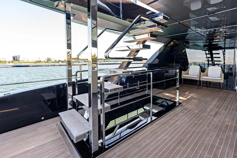 Slide: The Image of Luxurious interior of 2025 Riva 130' Bellissima yacht with modern staircase and seating area. - 40