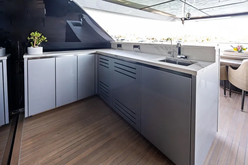 Slide: The Image of Modern kitchen area on 2025 Riva 130' Bellissima yacht with sleek cabinetry and sink. - 41