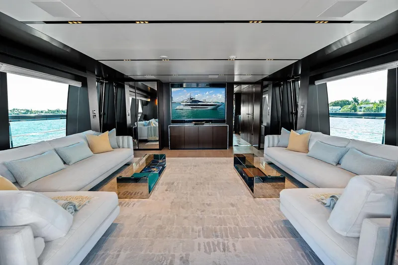 Slide: The Image of Luxurious interior of 2025 Riva 130' Bellissima yacht with elegant seating and panoramic windows. - 44