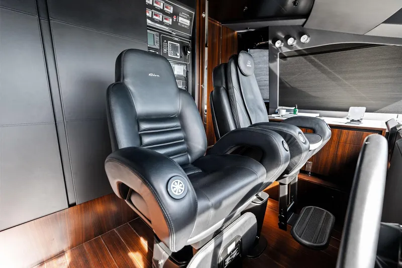Slide: The Image of Luxurious interior of 2025 Riva 130' Bellissima yacht with sleek black leather seating. - 49