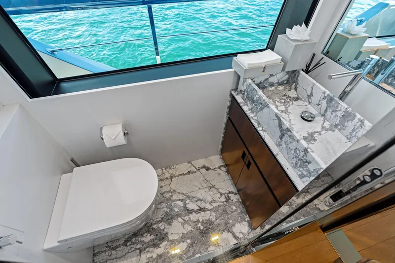 Slide: The Image of Luxurious bathroom on 2025 Riva 130' Bellissima yacht with marble sink and ocean view. - 52