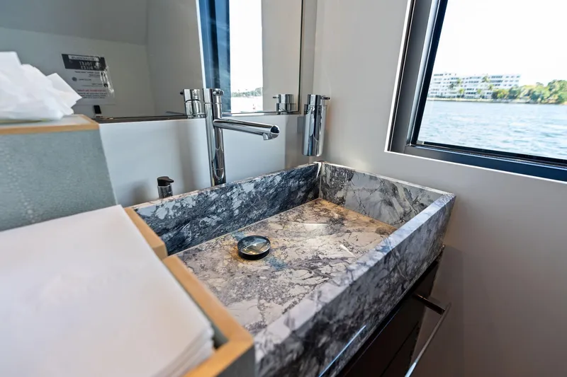Slide: The Image of Luxurious marble sink in 2025 Riva 130' Bellissima yacht bathroom with ocean view. - 53