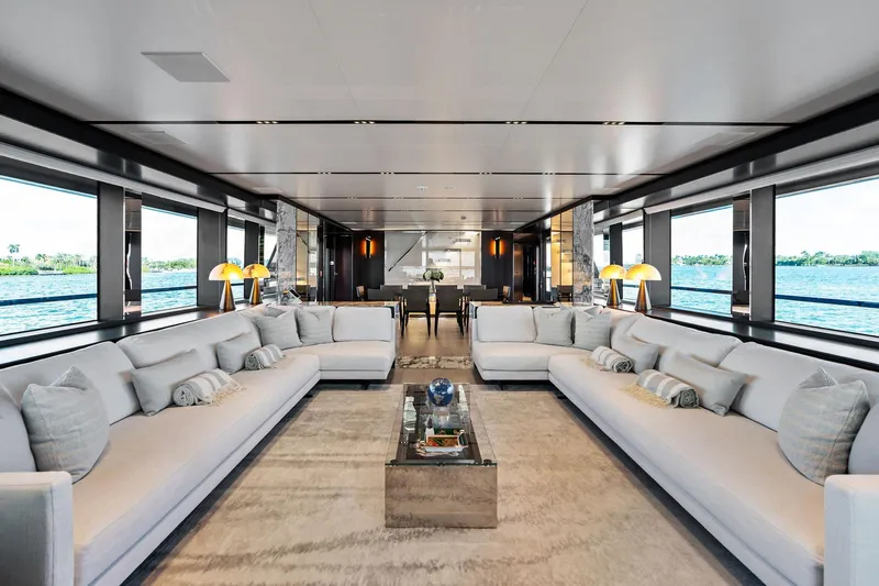 Slide: The Image of Luxurious interior of 2025 Riva 130' Bellissima yacht with elegant seating and panoramic windows. - 55
