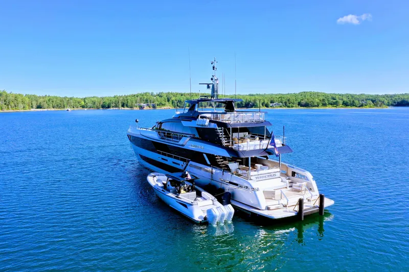 Slide: The Image of Luxurious 2025 Riva 130' Bellissima yacht with spacious deck and elegant seating on the water. - 6