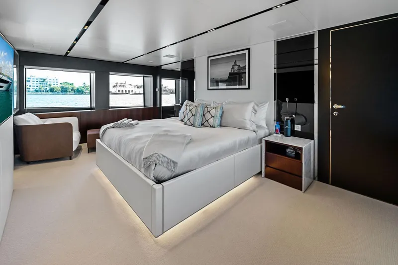 Slide: The Image of Luxurious bedroom interior on 2025 Riva 130' Bellissima yacht, featuring modern design and waterfront views. - 64