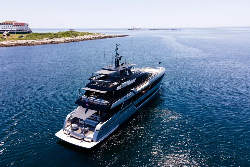 Slide: The Image of Luxurious 2025 Riva 130' Bellissima yacht cruising on clear blue waters. - 7