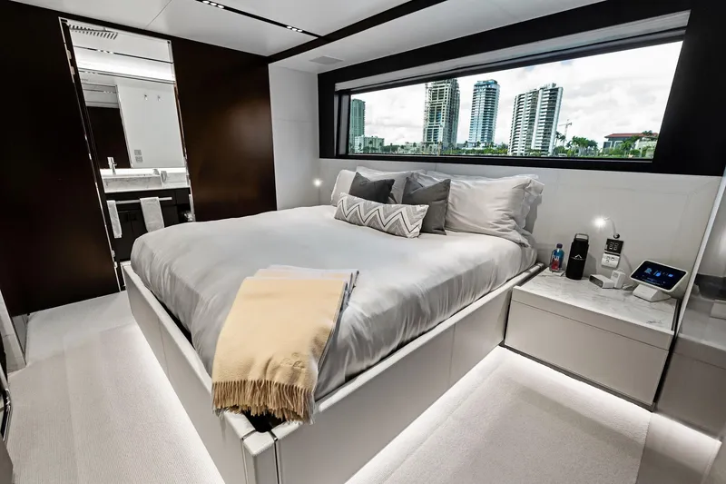 Slide: The Image of Luxurious bedroom interior of 2025 Riva 130' Bellissima yacht with modern design and city view. - 72
