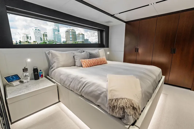 Slide: The Image of Luxurious bedroom interior of 2025 Riva 130' Bellissima yacht with cityscape view. - 75