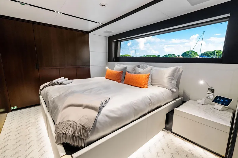 Slide: The Image of Luxurious bedroom interior of 2025 Riva 130' Bellissima yacht with large window view. - 82