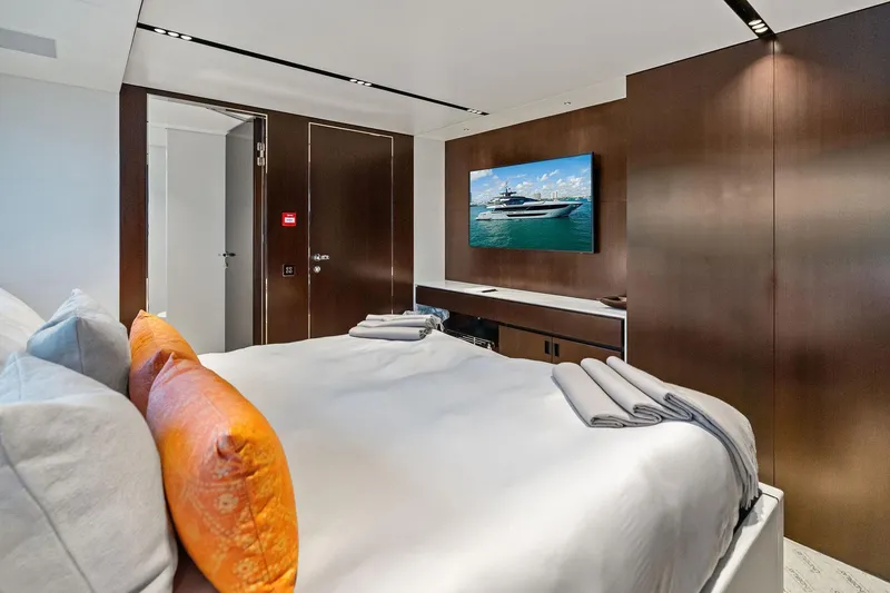 Slide: The Image of Luxurious bedroom interior on 2025 Riva 130' Bellissima yacht with modern decor and TV. - 83