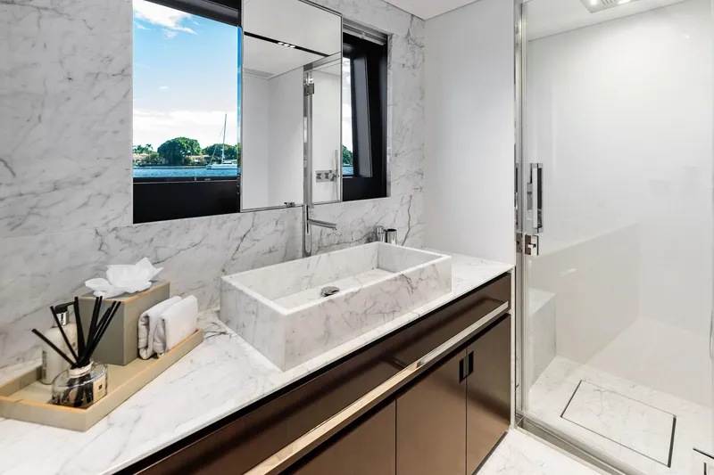 Slide: The Image of Luxurious marble bathroom on 2025 Riva 130' Bellissima yacht, featuring modern sink and shower. - 84