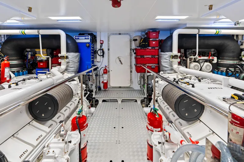 Slide: The Image of Engine room of 2025 Riva 130' Bellissima yacht, featuring advanced MTU engines and safety equipment. - 87