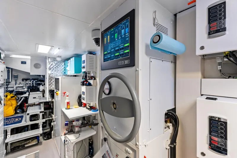 Slide: The Image of Engine room of 2025 Riva 130' Bellissima yacht with control panel and equipment. - 92