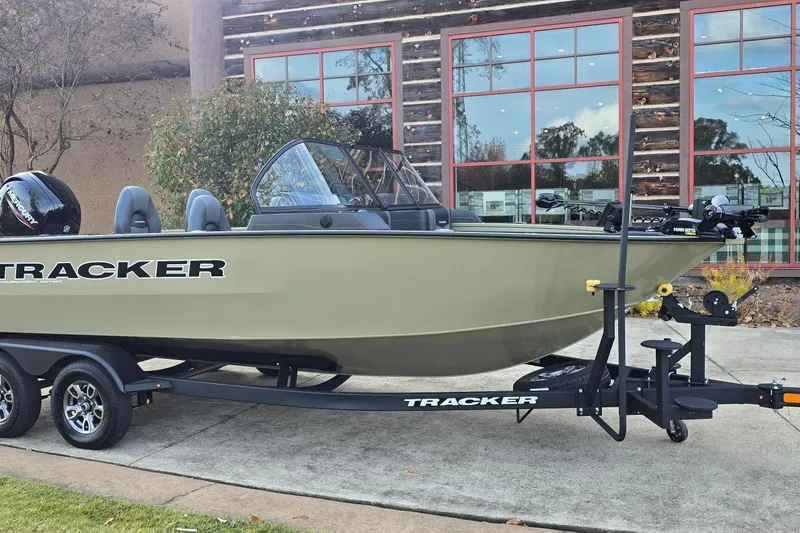 Slide: The Image of 2026 Tracker Targa V-19 Combo boat on trailer, parked outdoors. - 2