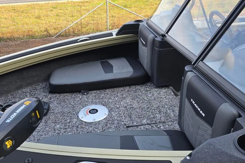 Slide: The Image of 2026 Tracker Targa V-19 Combo boat interior with seating and Minn Kota trolling motor. - 4