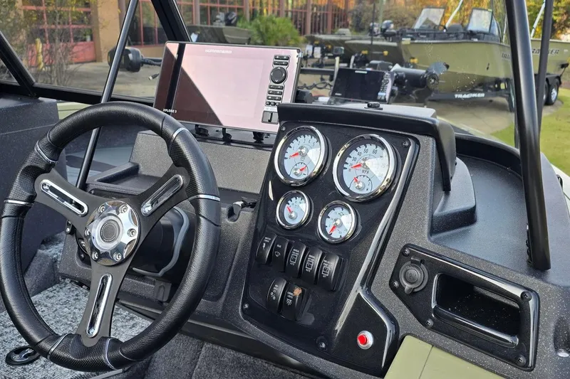 Slide: The Image of 2026 Tracker Targa V-19 Combo dashboard with steering wheel and gauges. - 6