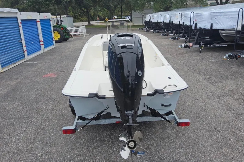 Slide: The Image of 2026 Mako Pro Skiff 17 CC boat with Mercury engine on trailer. - 3