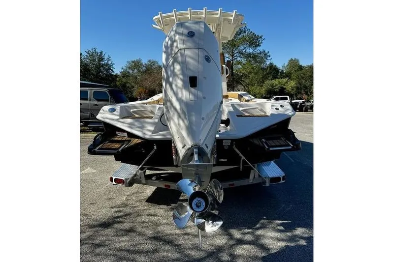 Slide: The Image of 2026 Ranger 2600 Bay boat on trailer, rear view with outboard motor. - 6