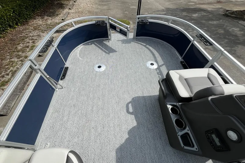 Slide: The Image of 2026 Sun Tracker Bass Buggy 16 XL Select pontoon boat interior with seating and railing. - 10