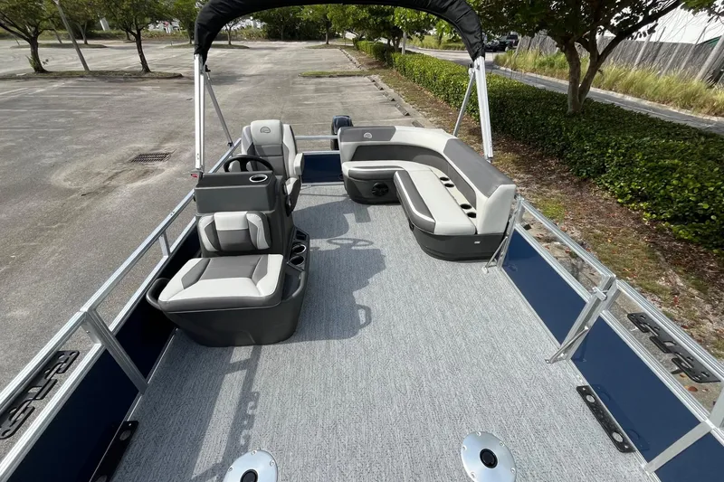 Slide: The Image of 2026 Sun Tracker Bass Buggy 16 XL Select pontoon boat with spacious seating and modern design. - 13