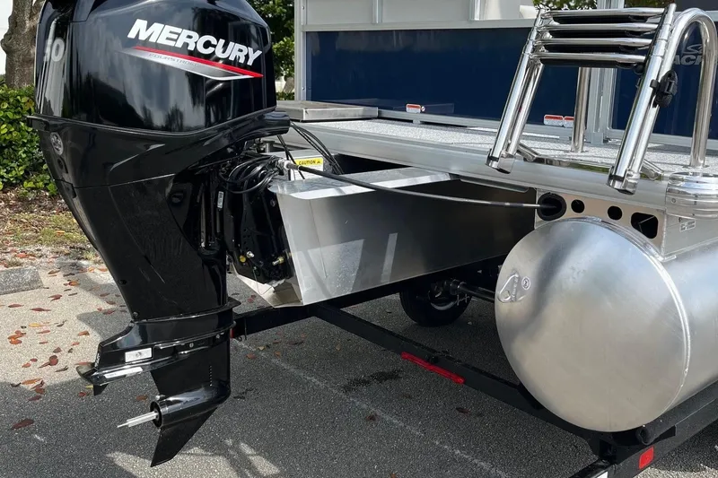 Slide: The Image of 2026 Sun Tracker Bass Buggy 16 XL Select with Mercury outboard motor, rear view. - 5