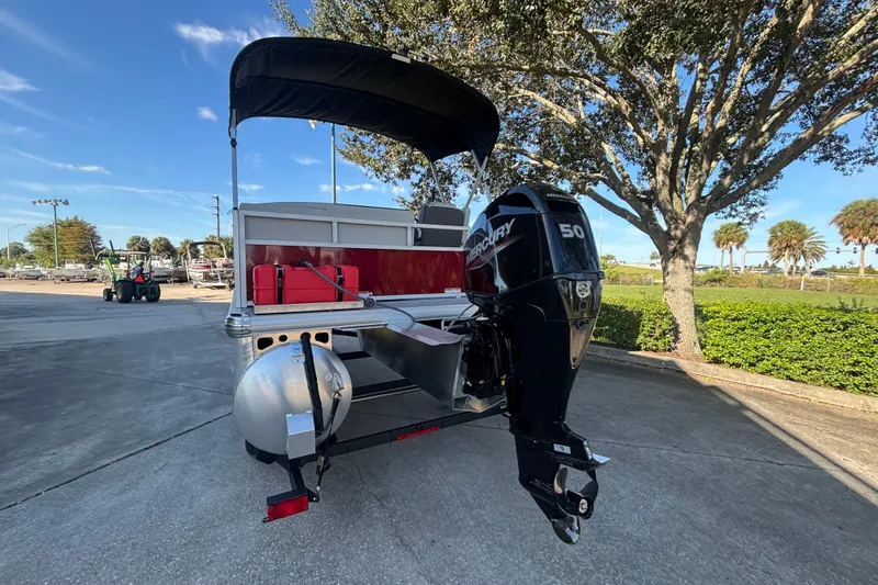 Slide: The Image of 2026 Sun Tracker Bass Buggy 16 XL Select pontoon boat with Mercury 50 engine. - 2