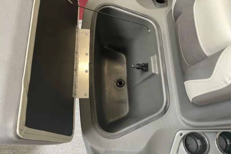 Slide: The Image of 2026 Sun Tracker Bass Buggy 16 XL Select interior storage compartment with seating detail. - 10