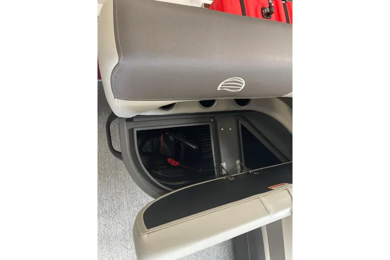 Slide: The Image of 2026 Sun Tracker Bass Buggy 16 XL Select storage compartment with open seat revealing interior. - 13