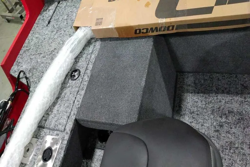 Slide: The Image of Interior of 2026 Tracker Pro Guide V-175 Combo boat with packaging materials. - 70