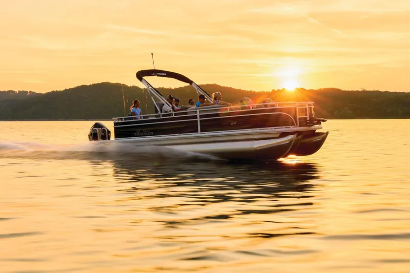 Slide: The Image of 2026 Sun Tracker Sportfish 24 XP3 interior with seating and storage area. - 4