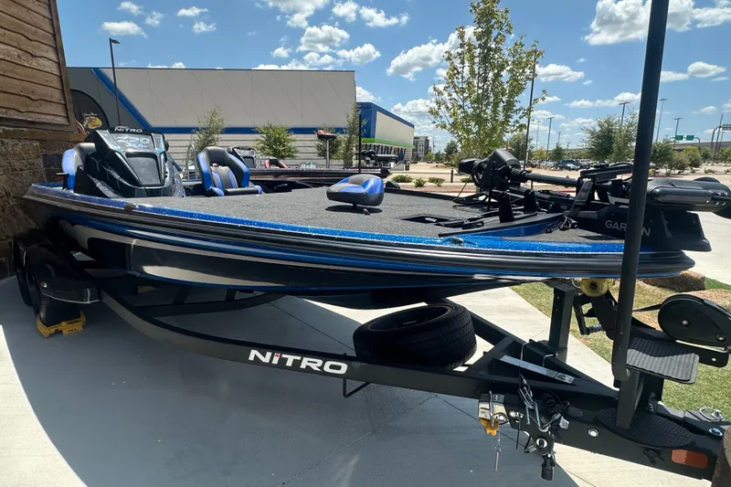 Slide: The Image of 2026 Nitro Z20 XL Pro boat on trailer, parked outdoors under a sunny sky. - 2