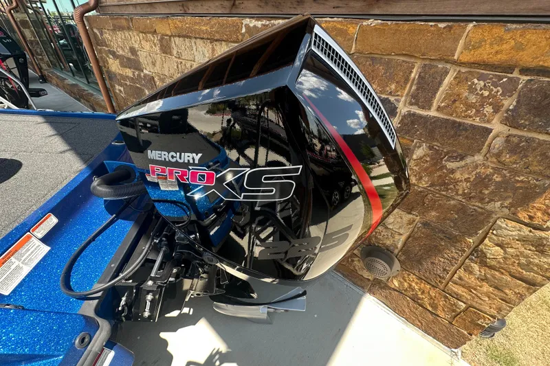 Slide: The Image of 2026 Nitro Z20 XL Pro with Mercury Pro XS engine, parked by a stone wall. - 5