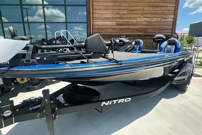 Slide: The Image of 2026 Nitro Z20 XL Pro boat with sleek design, parked outdoors. - 1