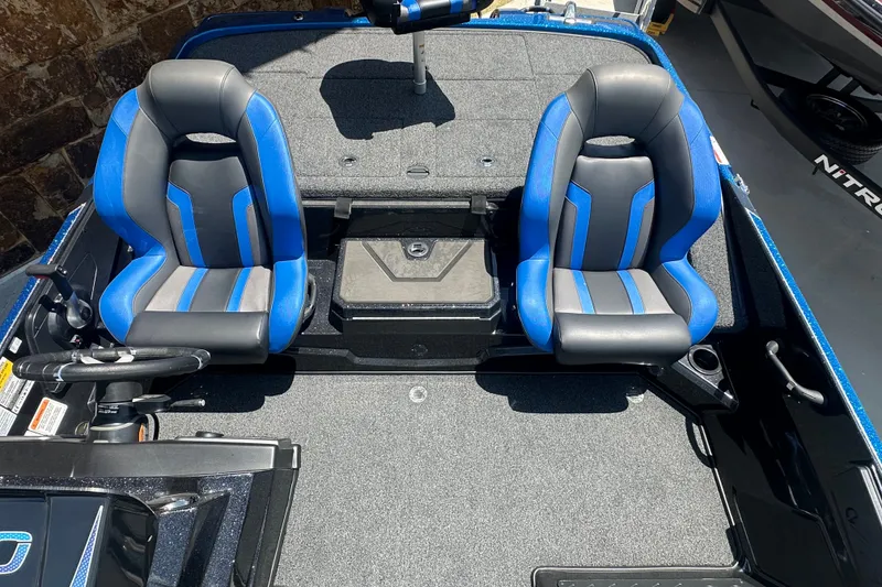 Slide: The Image of 2026 Nitro Z20 XL Pro boat interior with dual blue and black seats. - 11