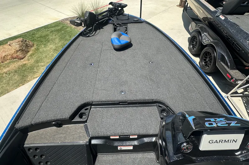 Slide: The Image of 2026 Nitro Z20 XL Pro boat deck with Garmin equipment, parked on concrete. - 8
