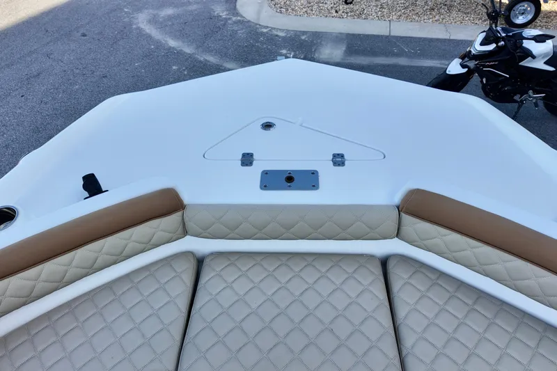 Slide: The Image of 2025 NauticStar 211 Hybrid boat interior with quilted seating and sleek design. - 15