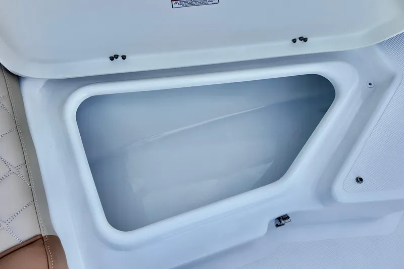 Slide: The Image of Open storage compartment on 2025 NauticStar 211 Hybrid boat. - 6