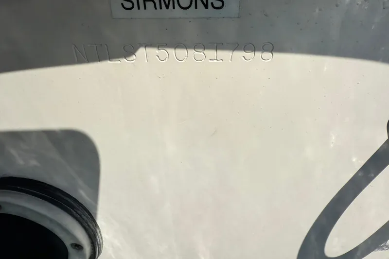 Slide: The Image of 1998 Grady-White Advance 247 boat hull with serial number NTLST508I798 visible. - 15