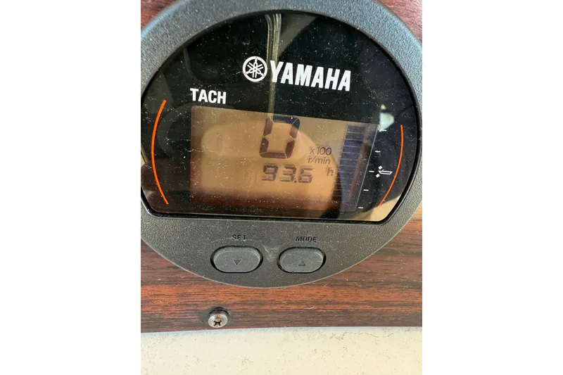 Slide: The Image of Yamaha tachometer displaying 93.6 hours on a 1998 Grady-White Advance 247 boat. - 6