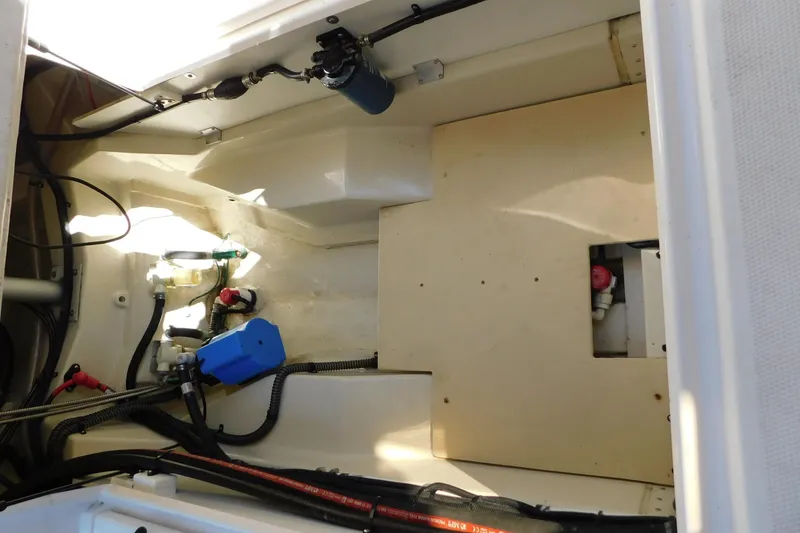 Slide: The Image of Engine compartment of 2022 Ranger Tugs R-27, showcasing wiring and components. - 24