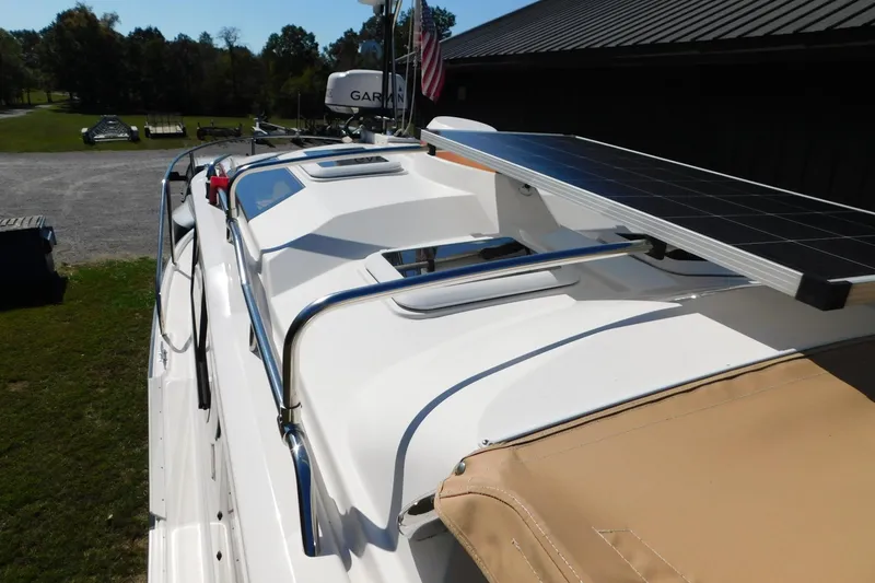 Slide: The Image of 2022 Ranger Tugs R-27 boat with solar panel on deck, parked outdoors. - 43