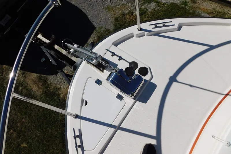 Slide: The Image of 2022 Ranger Tugs R-27 boat deck with anchor and railing, viewed from above. - 46