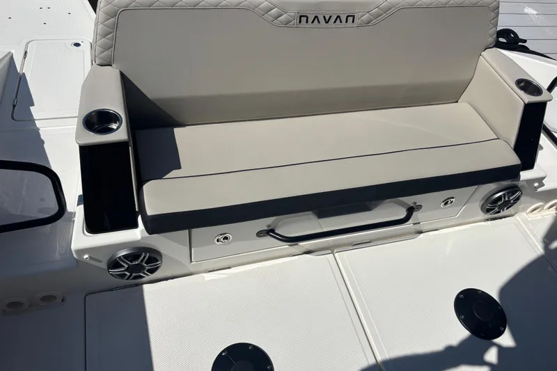 Slide: The Image of Navan C30 2026 boat seat with cup holders and speakers on deck. - 11