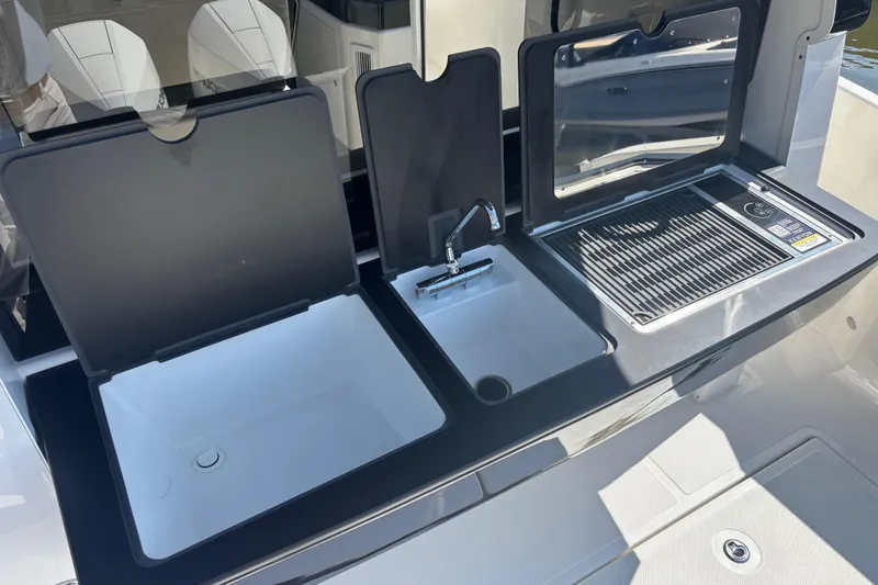 Slide: The Image of Outdoor kitchen setup on 2026 Navan C30 boat with sink and grill. - 15