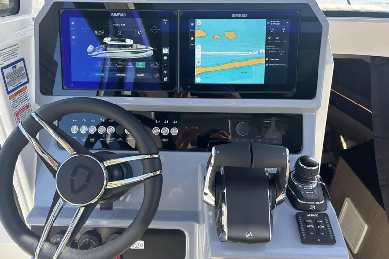 Slide: The Image of 2026 Navan C30 boat dashboard with dual Simrad displays and modern controls. - 18